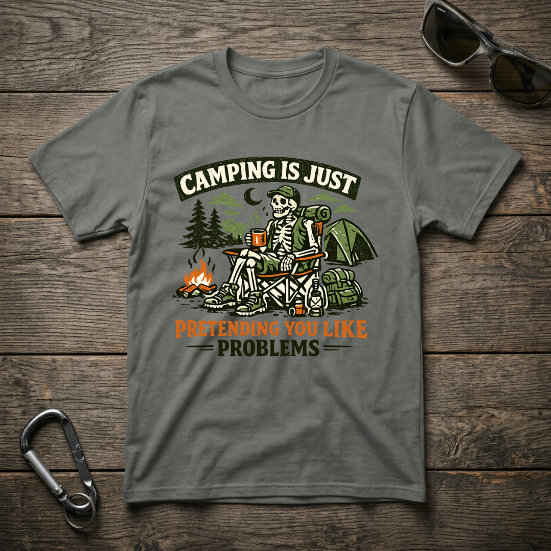 Gray graphic T-shirt from Designed For The Wild Co featuring camping-themed text and casual garment-dyed fabric.