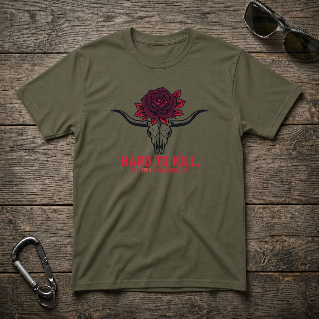 Military green graphic T-shirt featuring a longhorn skull design from Designed For The Wild Co, heavyweight casual style.
