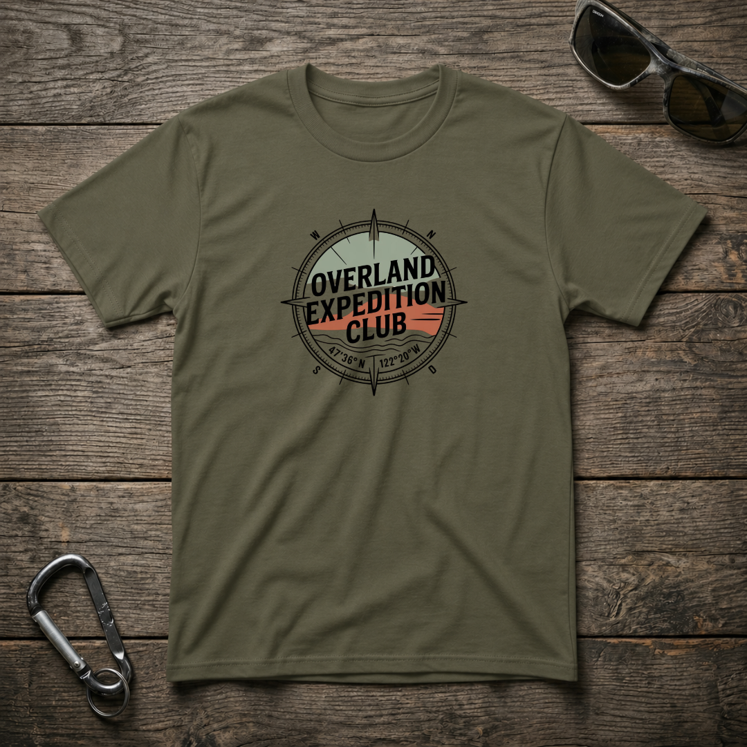 Military green Designed For The Wild Co Overland Expedition heavyweight graphic T-shirt with outdoor adventure design.