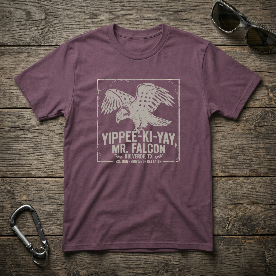 Berry-colored Yippee Ki Yay Mr. Falcon graphic T-shirt by Designed For The Wild Co, featuring a bold printed design on soft cotton.