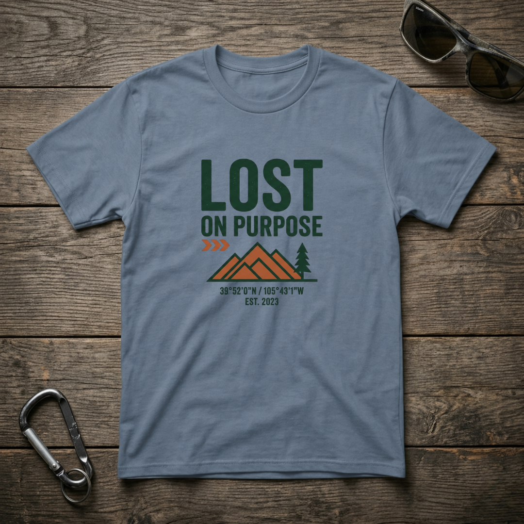 Blue graphic T-shirt from Lost on Purpose by Designed For The Wild Co with a casual, worn-in look and vibrant blue denim color.