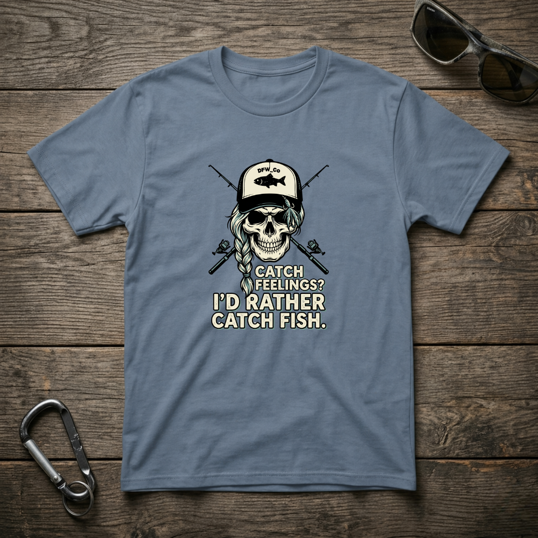 Blue graphic T-shirt by Designed For The Wild Co with "I'd Rather Catch Fish" print, casual garment-dyed cotton tee.