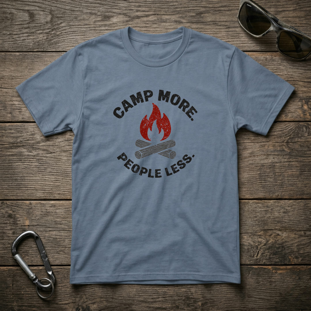 Blue graphic T-shirt from Designed For The Wild Co with "Camp More, People Less" slogan, garment-dyed for a soft, vintage look.