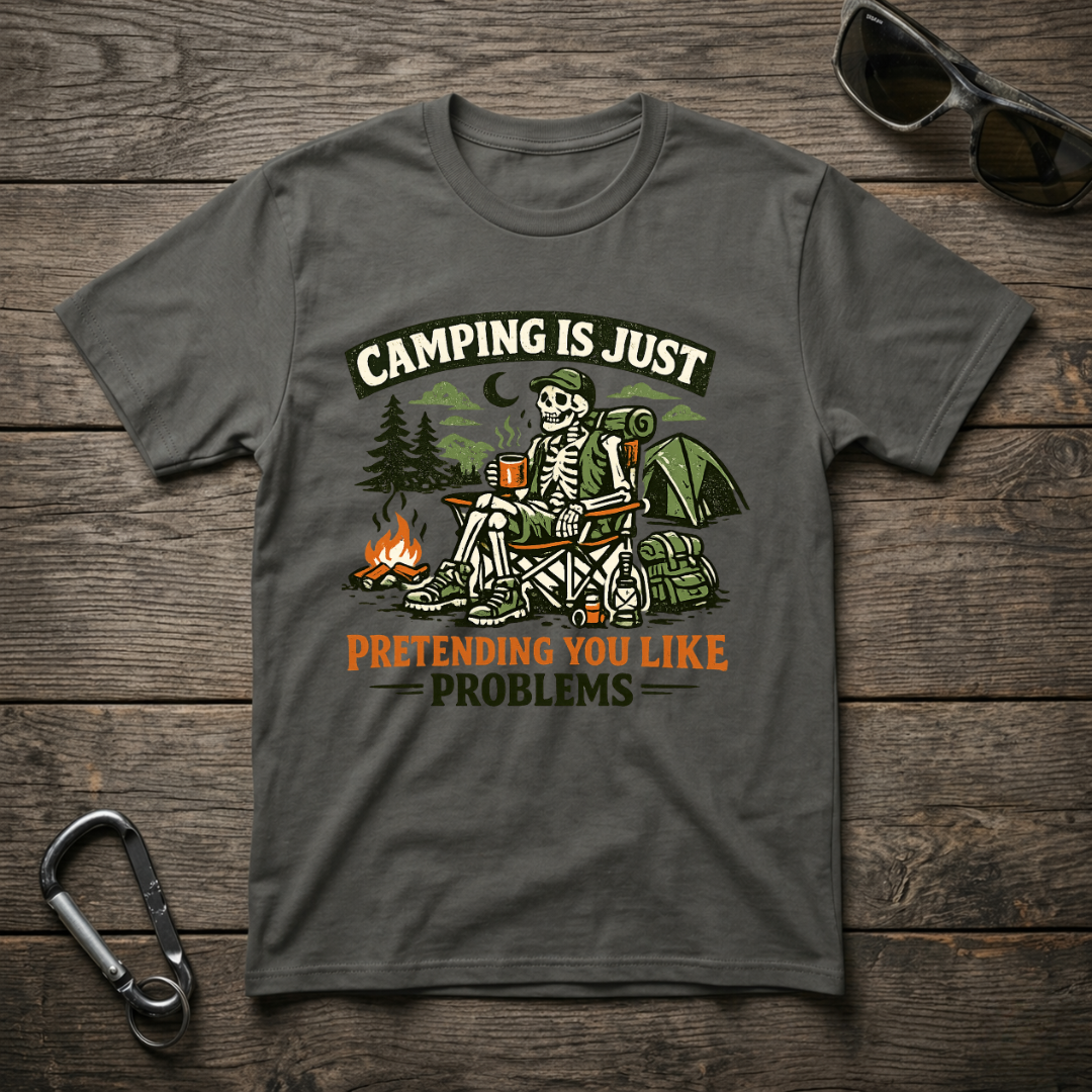 Graphic T-Shirt from Designed For The Wild Co with "Camping Is Just Pretending" slogan, in a garment-dyed fabric, shown on a model.