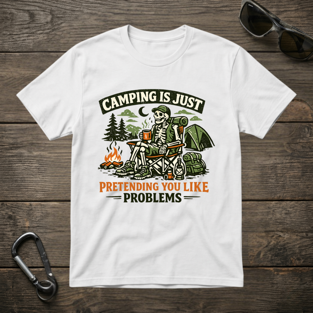White graphic T-shirt from Designed For The Wild Co with "Camping Is Just Pretending" slogan and casual fit.