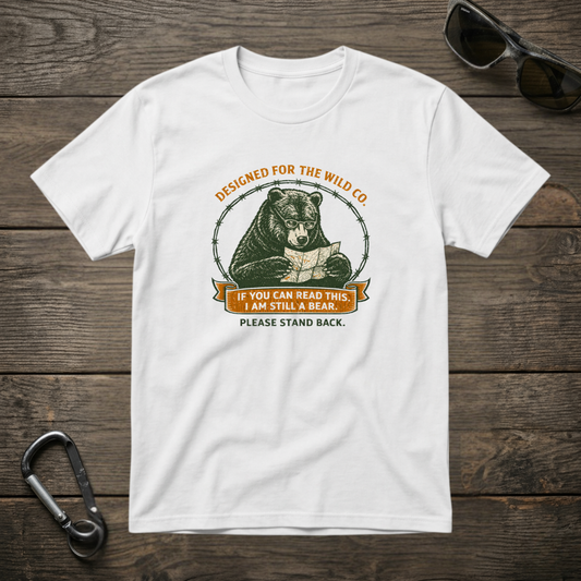 White graphic T-shirt from Designed For The Wild Co featuring "I Am Still A Bear" print, garment-dyed for a soft, vintage look.