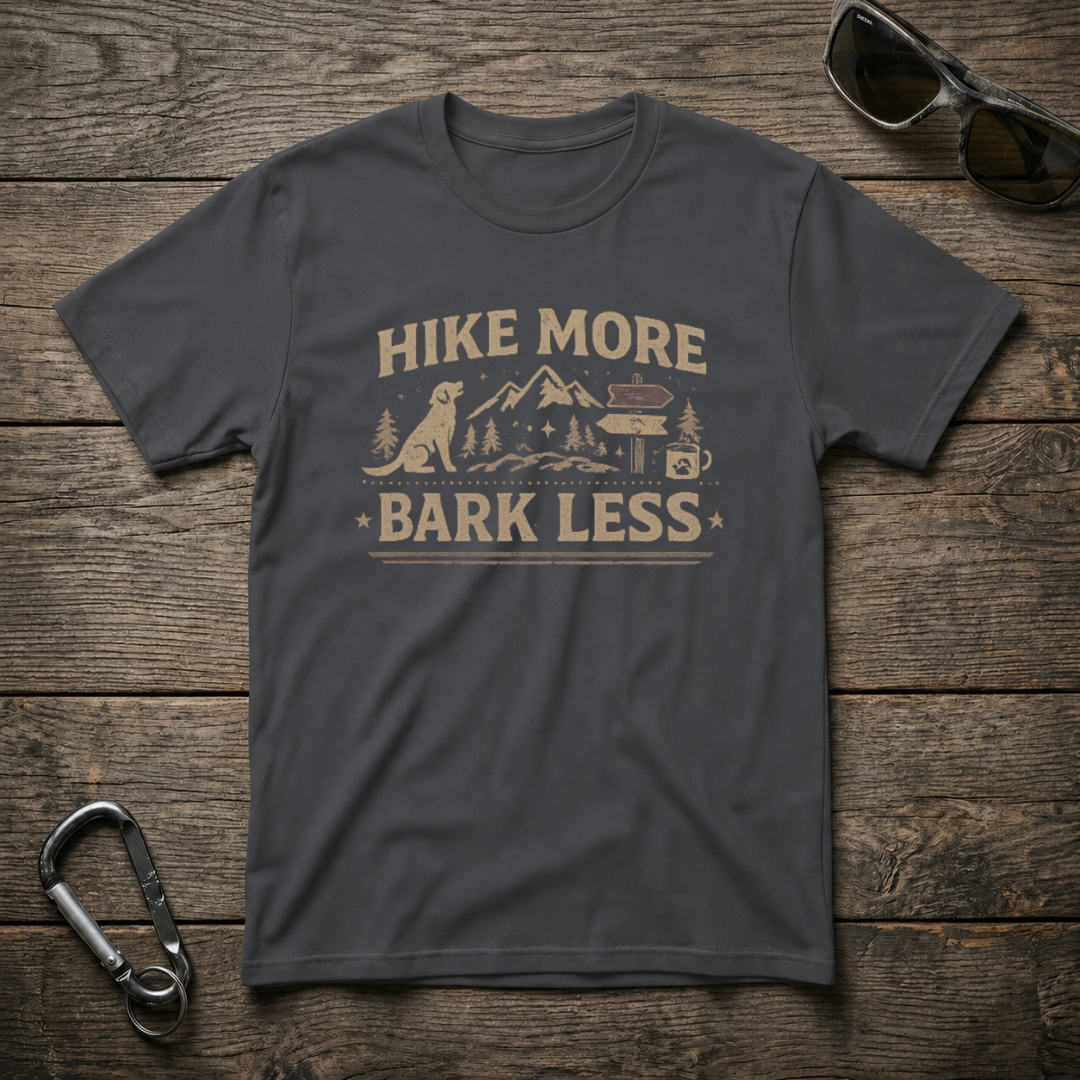 Dark heather graphic T-shirt by Designed For The Wild Co featuring "Hike More, Bark Less" design for outdoor enthusiasts.