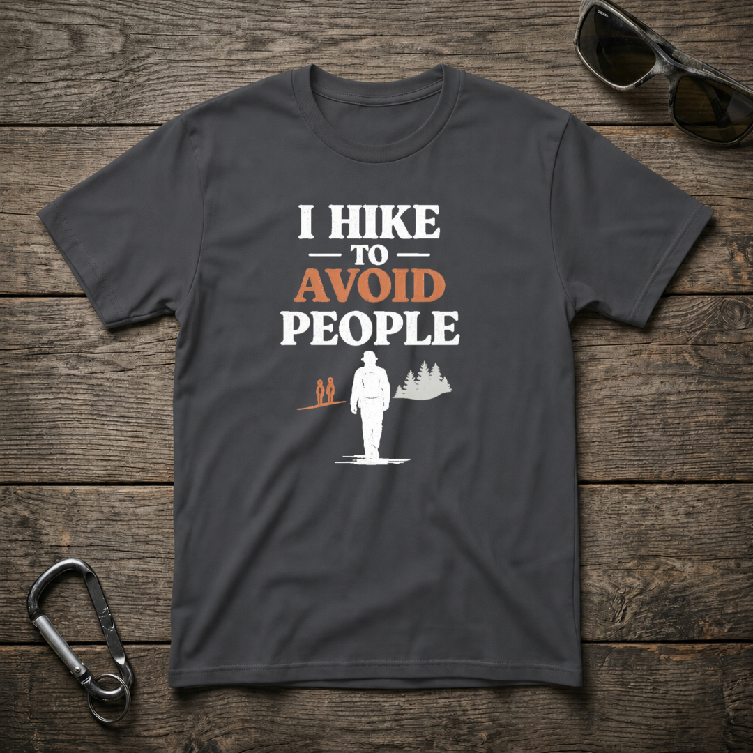 Dark heather graphic T-shirt by Designed For The Wild Co featuring "I Hike to Avoid People" text and outdoor hiking design.