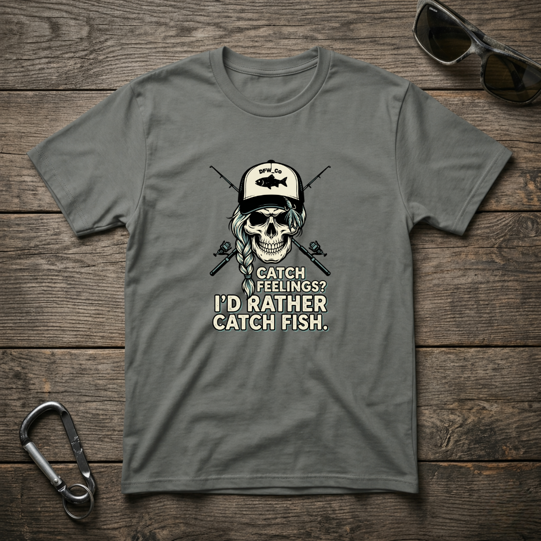 Gray graphic T-shirt by Designed For The Wild Co with "I'd Rather Catch Fish" slogan and fish illustration.