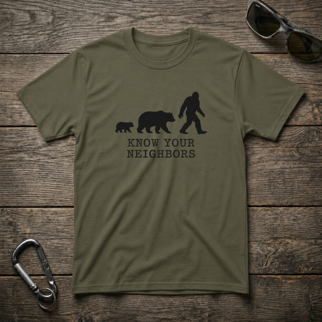 Military green Know Your Neighbors heavyweight graphic T-shirt by Designed For The Wild Co with bold print design.