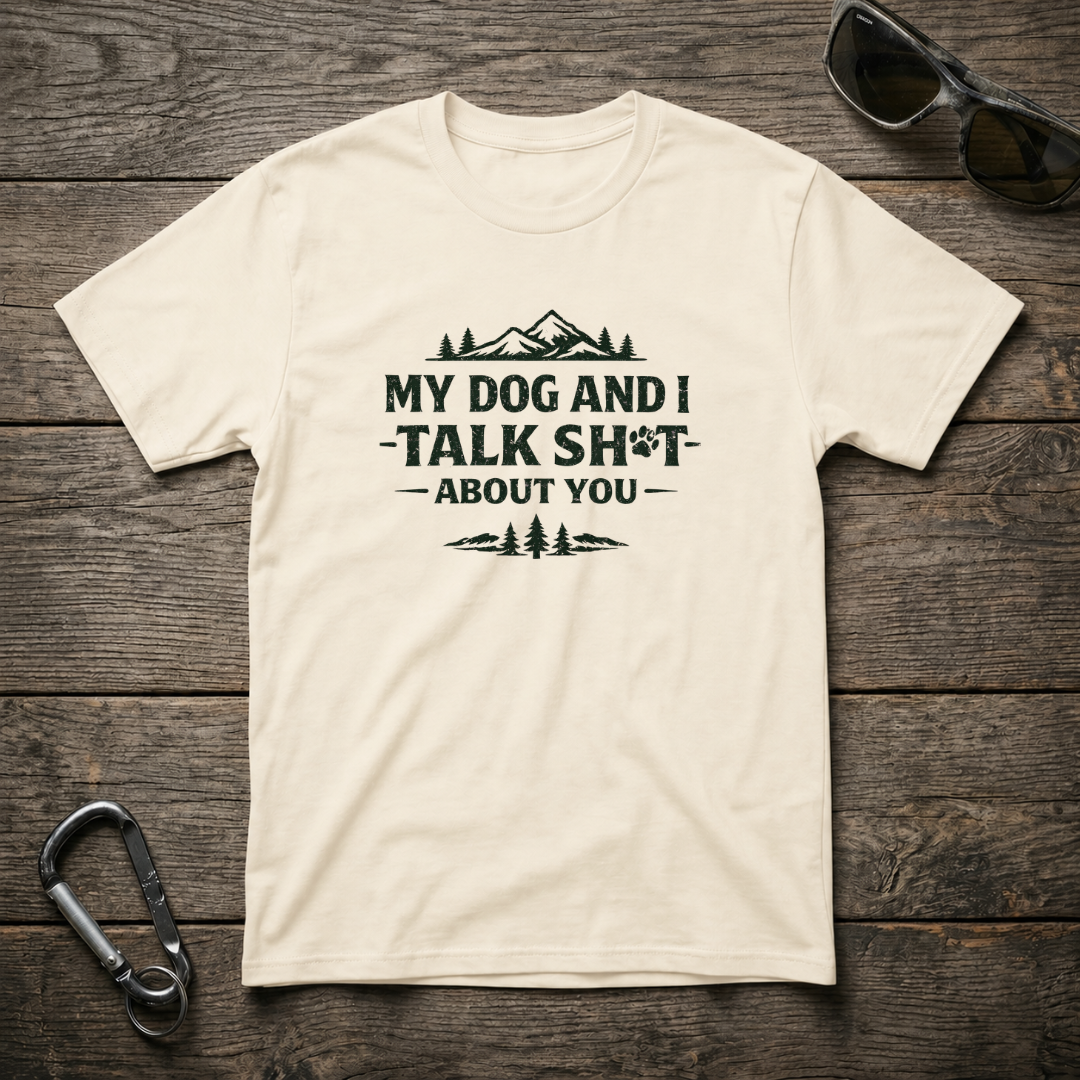 Gray graphic T-shirt from Designed For The Wild Co featuring the phrase "My Dog and I Talk Sh*t" in bold black lettering.