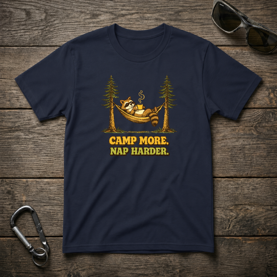 Navy heavyweight graphic T-shirt by Designed For The Wild Co with "Camp More Nap Harder" slogan and outdoor-themed design.