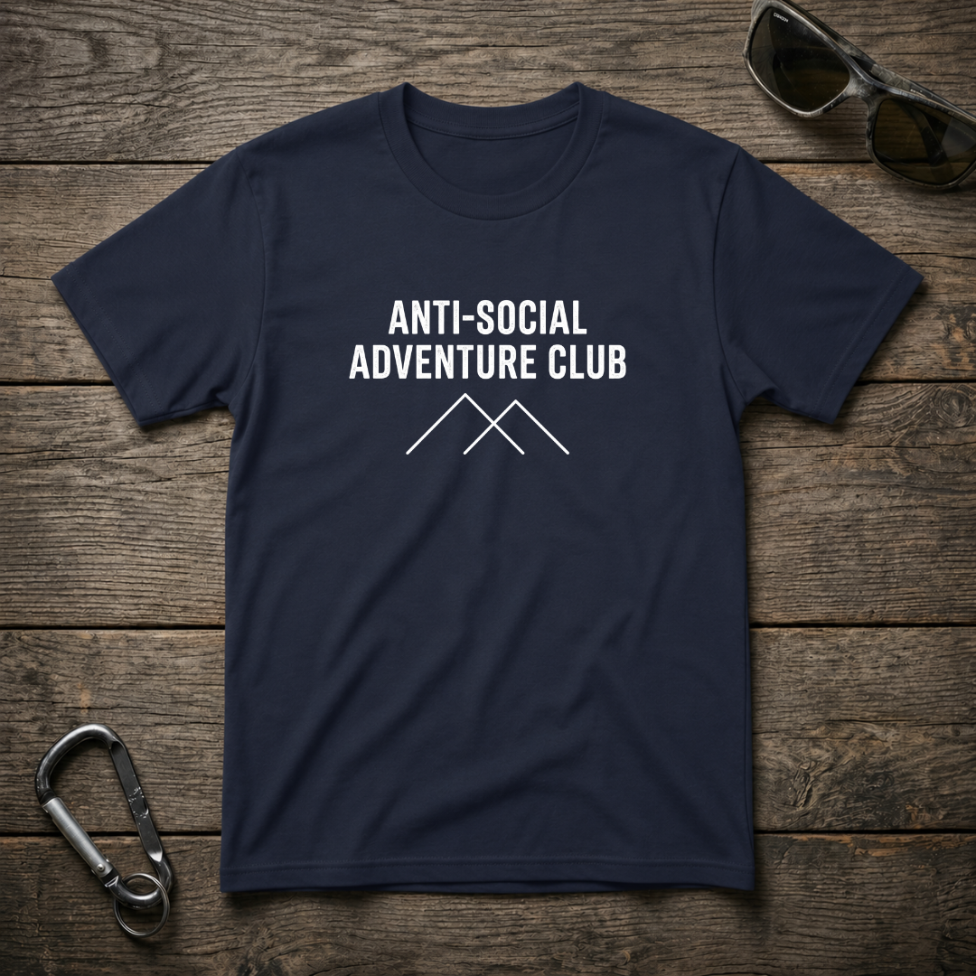 Navy graphic T-shirt from Designed For The Wild Co featuring bold anti-social adventure club design on lightweight fabric.