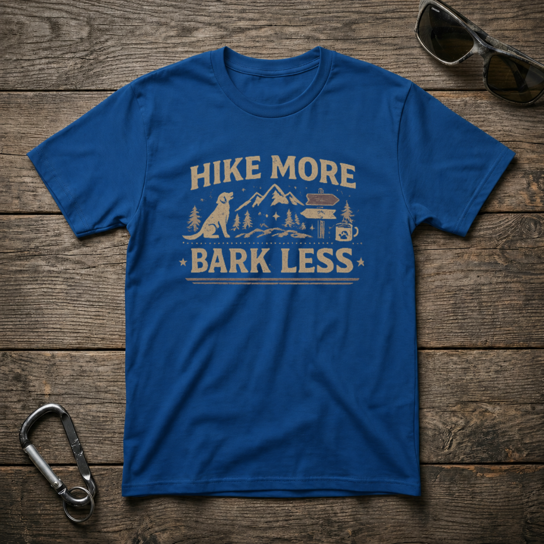 Royal blue graphic T-shirt by Designed For The Wild Co with "Hike More, Bark Less" slogan and nature-themed design.