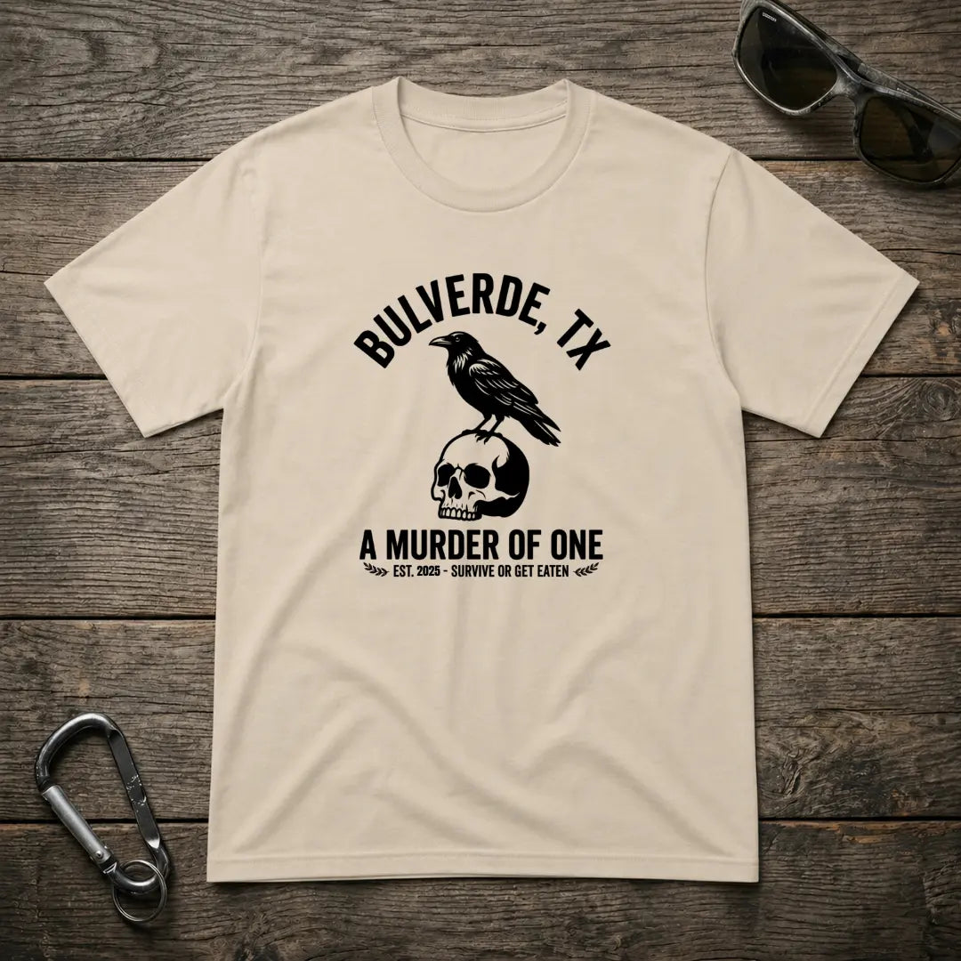 Graphic T-Shirt by Designed For The Wild Co featuring the "Murder Of One" design on a heavyweight cotton shirt in sand color.