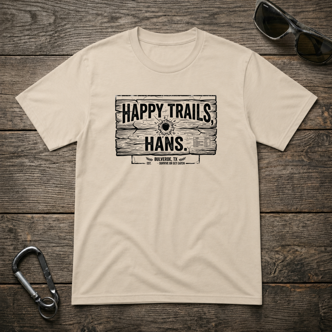 Happy Trails Hans heavyweight graphic T-shirt by Designed For The Wild Co featuring outdoor-themed artwork on a sand-colored fabric.