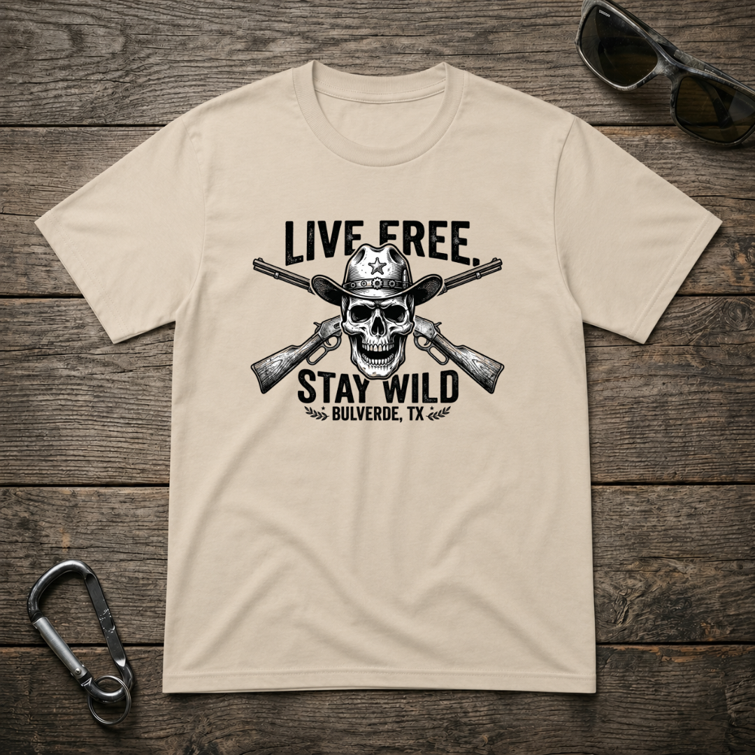 Designed For The Wild Co heavyweight graphic T-shirt with "Live Free Stay Wild" design, shown in a tan color.