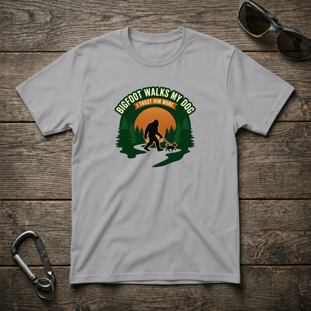 Sport Grey Bigfoot walks my dog graphic T-shirt by Designed For The Wild Co, soft cotton crewneck tee with playful Bigfoot design.