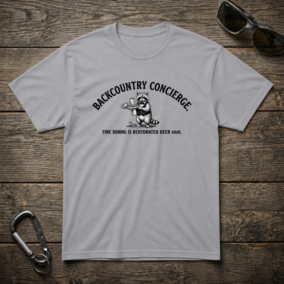 Sports grey graphic T-shirt from Designed For The Wild Co, Backcountry Concierge Heavyweight T-Shirt with outdoor-inspired design.