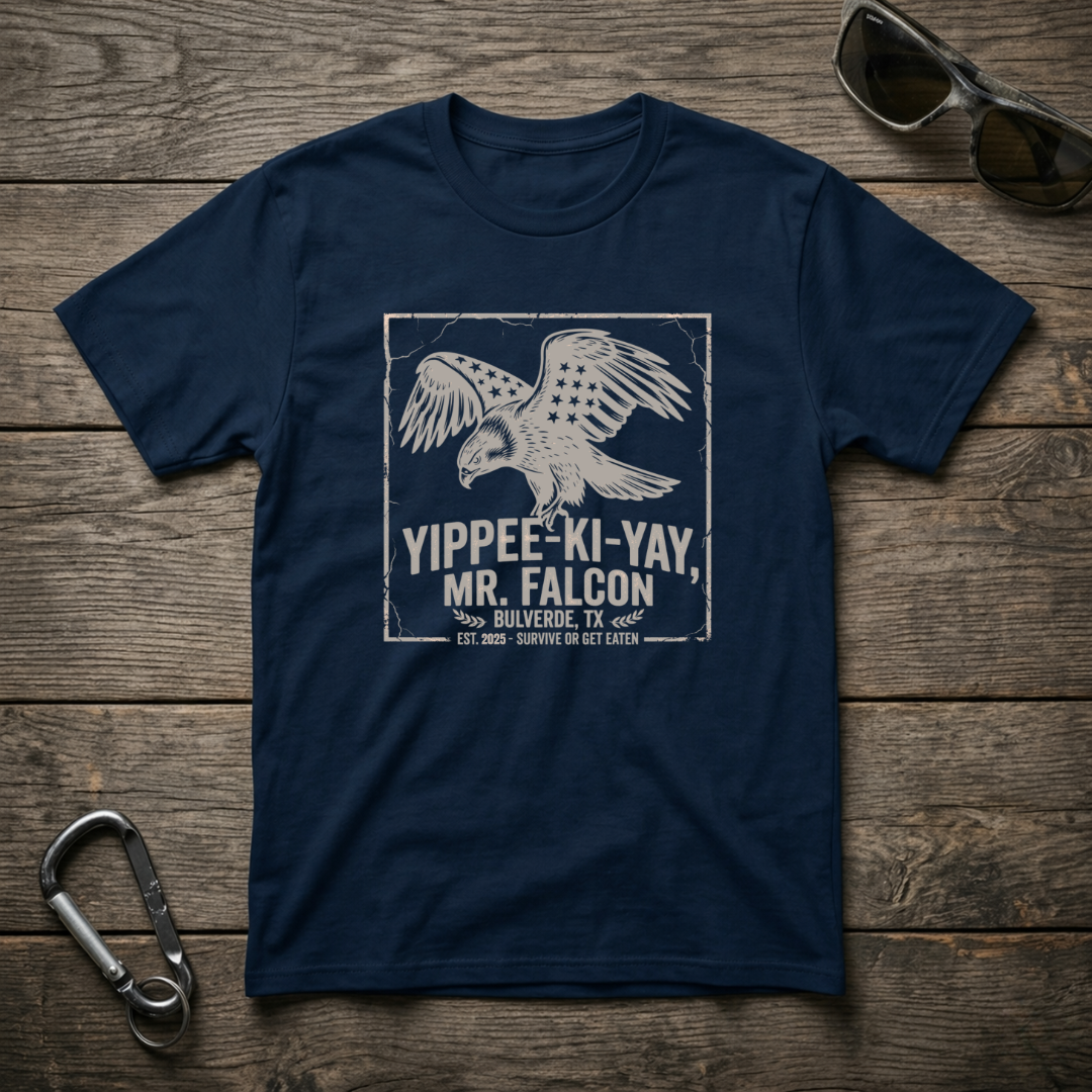 True navy graphic T-shirt from Designed For The Wild Co featuring the Yippee Ki Yay Mr. Falcon design on soft, garment-dyed fabric.