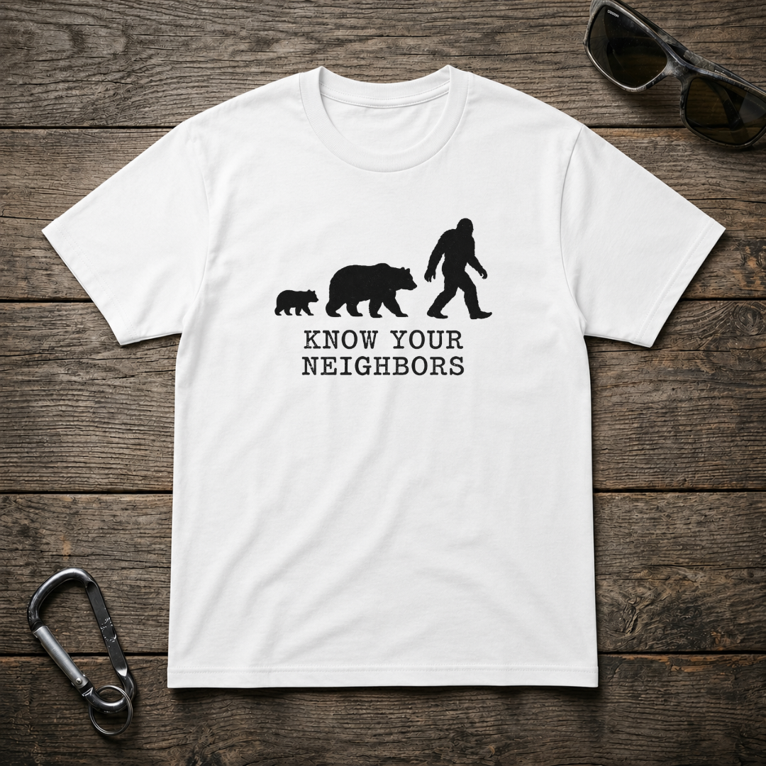 White heavyweight graphic T-shirt by Designed For The Wild Co featuring a bold "Know Your Neighbors" design on the front.