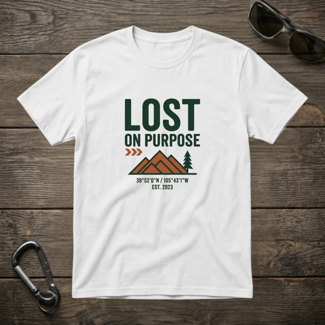 White graphic T-shirt from Designed For The Wild Co with a casual, worn-in look and a stylish design on the front.